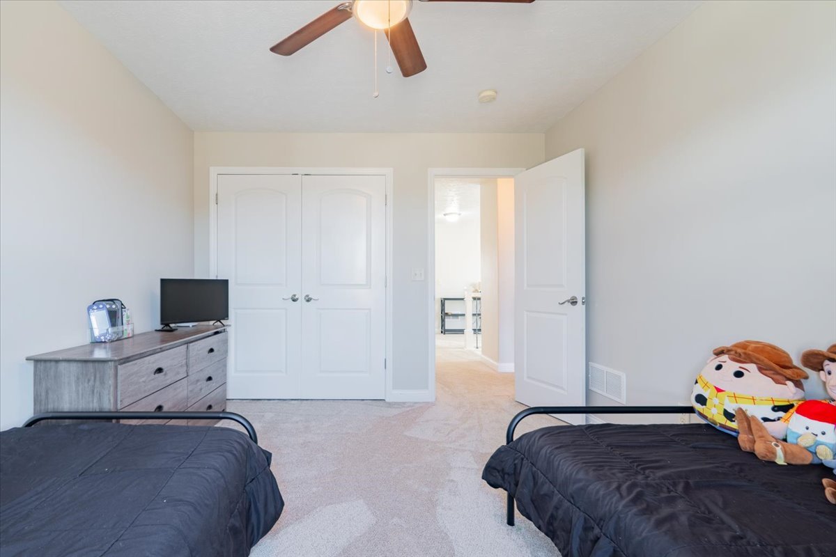 1236 Blue Bill Way Normal, IL 61761 - Photo 21 of 38 a bedroom with a bed and wooden floor