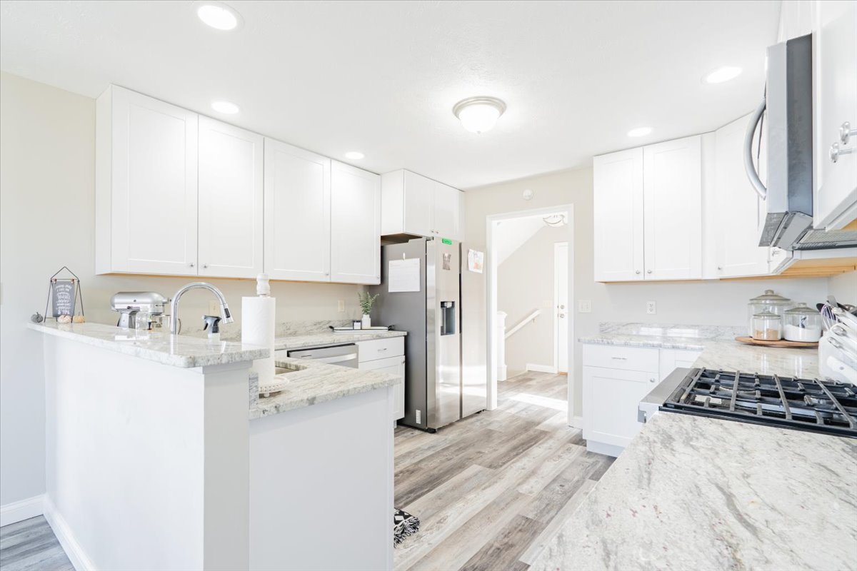 1236 Blue Bill Way Normal, IL 61761 - Photo 4 of 38 a kitchen with stainless steel appliances granite countertop a refrigerator and a stove top oven