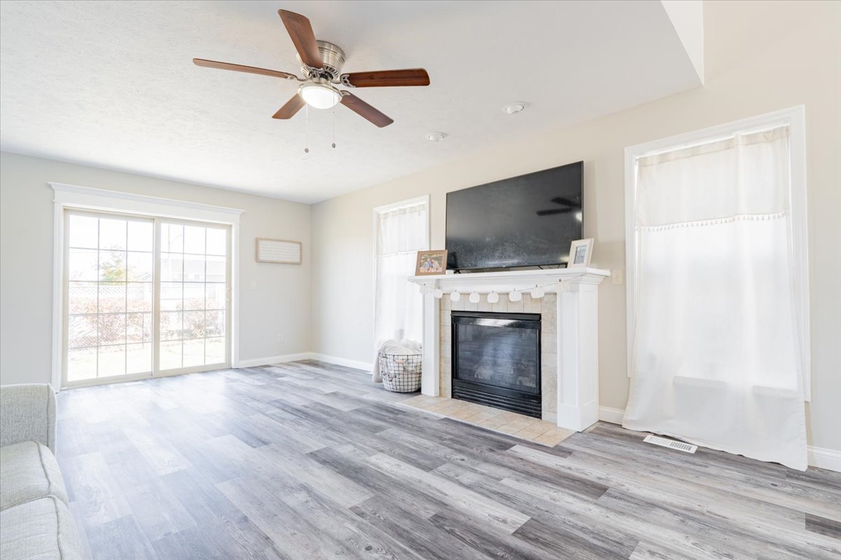 1236 Blue Bill Way Normal, IL 61761 - Photo 6 of 38 wooden floor fireplace and windows in a room
