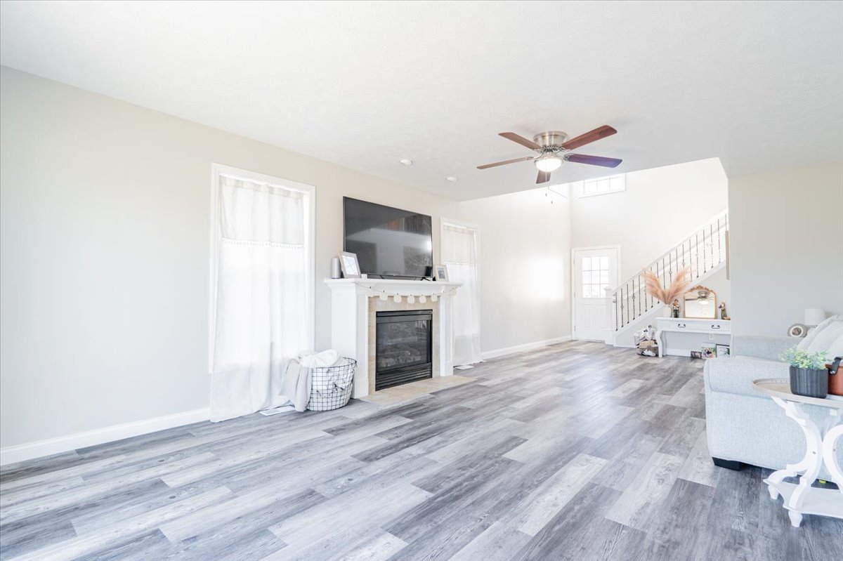 1236 Blue Bill Way Normal, IL 61761 - Photo 7 of 38 a living room with furniture and a fireplace