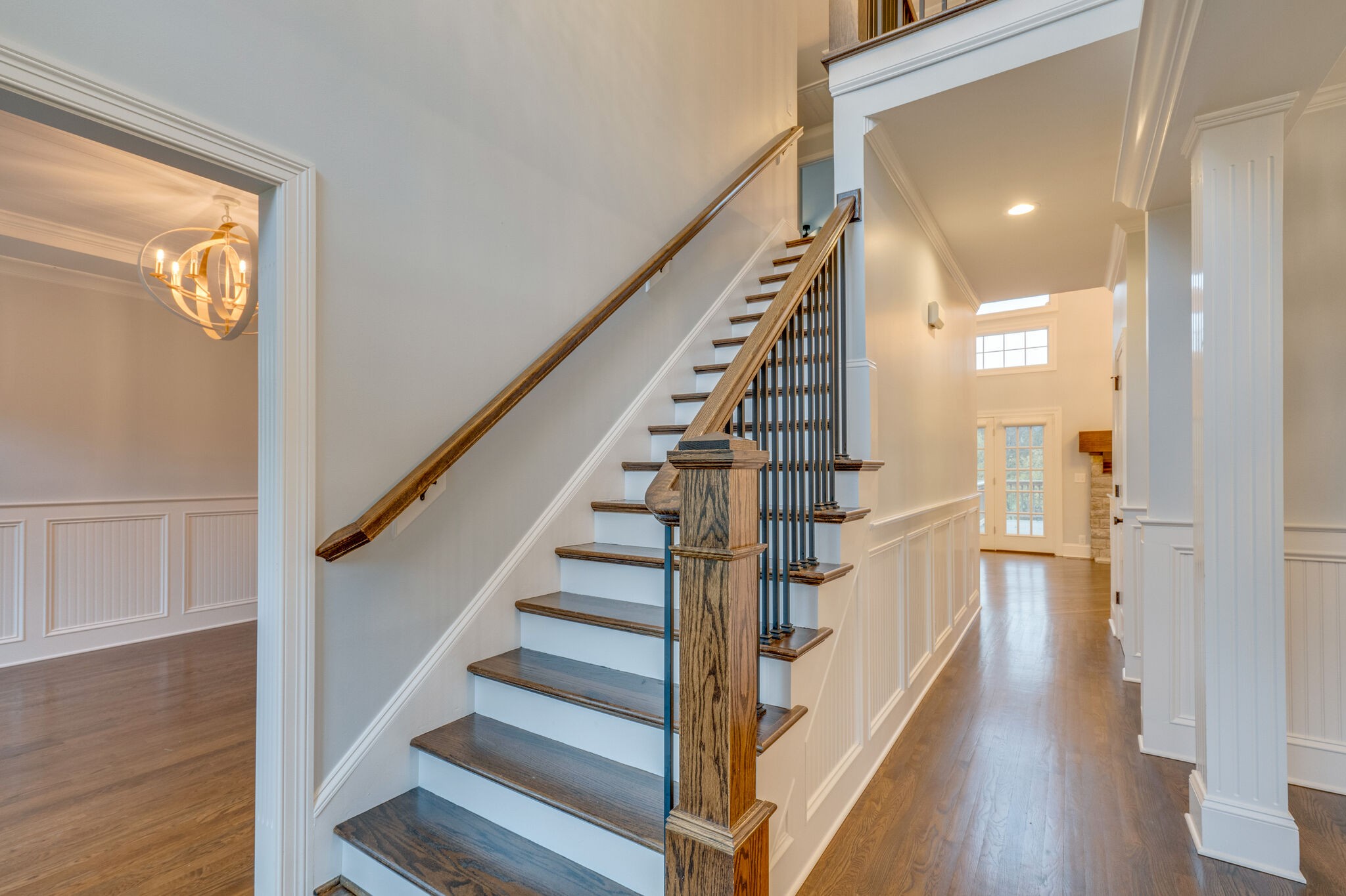 747 High Point Ridge Road Franklin, TN 37069 - Photo 2 of 38 a view of staircase with lots of frames on wall and wooden floor