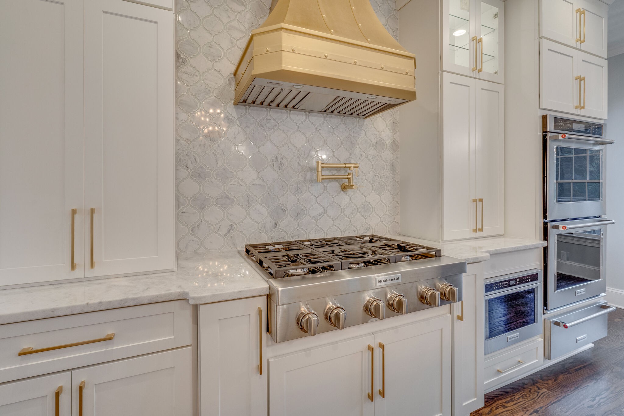 747 High Point Ridge Road Franklin, TN 37069 - Photo 12 of 38 a kitchen with stainless steel appliances granite countertop a stove and a microwave