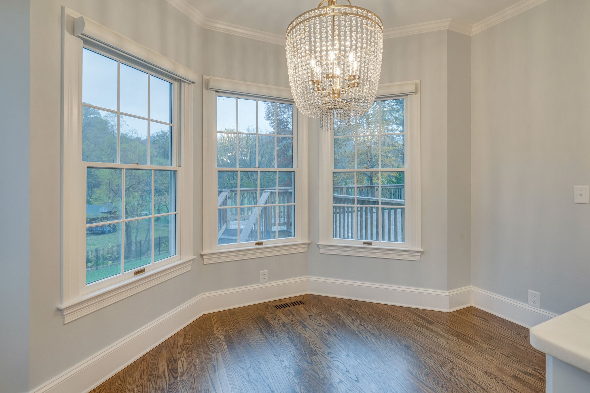 747 High Point Ridge Road Franklin, TN 37069 - Photo 13 of 38 a view of empty room with wooden floor and chandelier