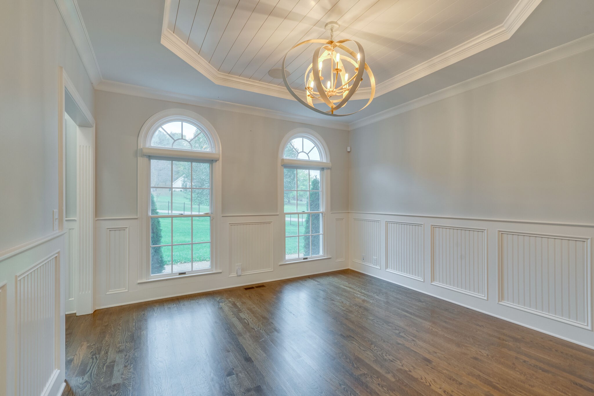 747 High Point Ridge Road Franklin, TN 37069 - Photo 14 of 38 an empty room with wooden floor fan and windows