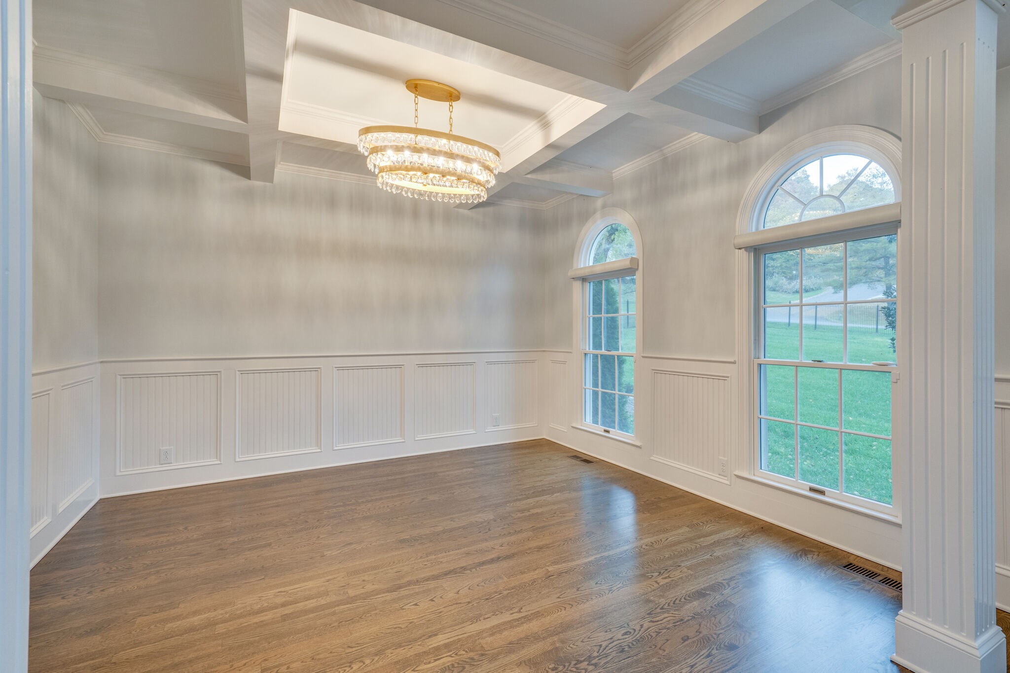 747 High Point Ridge Road Franklin, TN 37069 - Photo 3 of 38 an empty room with wooden floor and windows