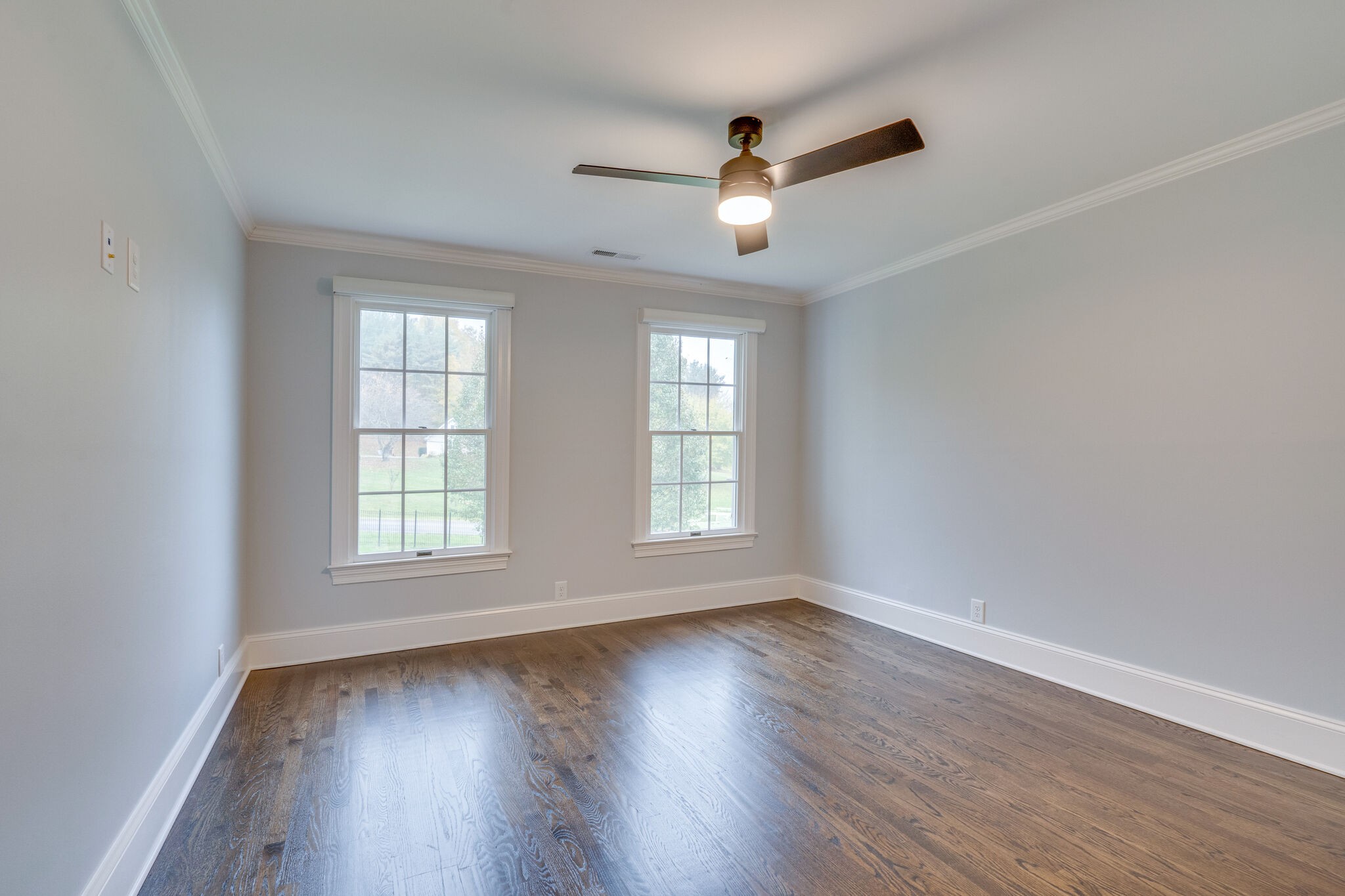 747 High Point Ridge Road Franklin, TN 37069 - Photo 29 of 38 an empty room with wooden floor windows and ceiling fan
