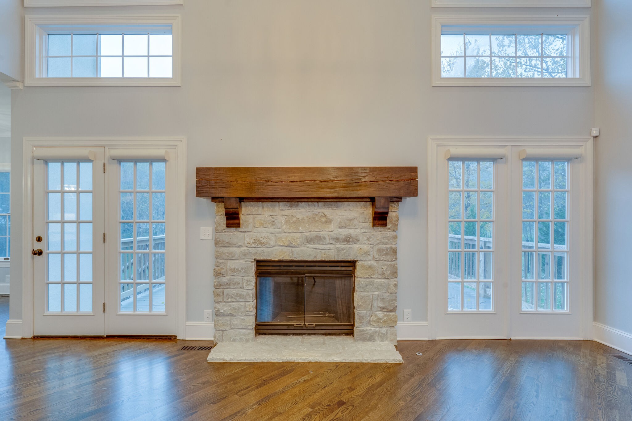747 High Point Ridge Road Franklin, TN 37069 - Photo 5 of 38 a living room with a fireplace and wooden floor