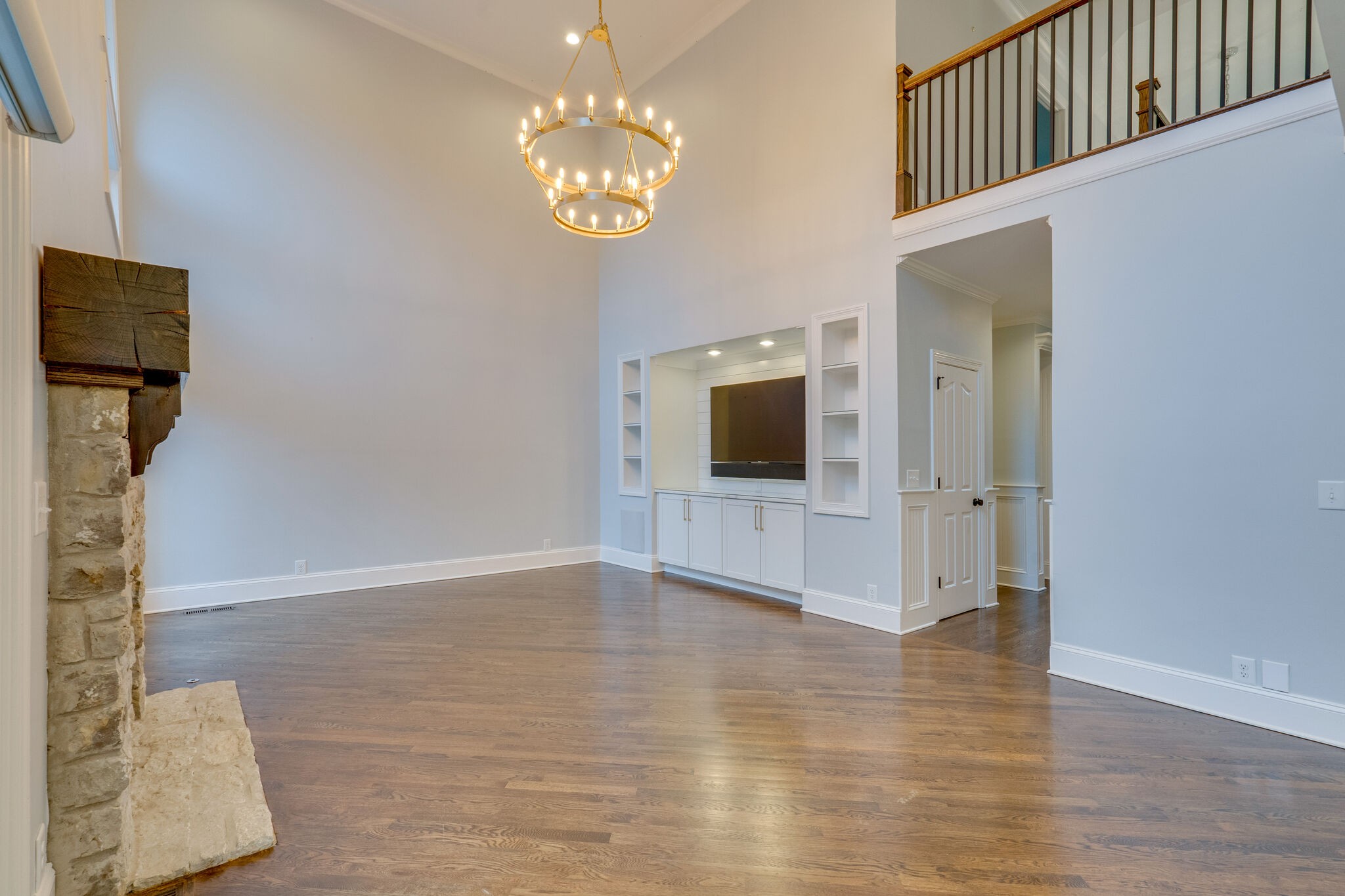 747 High Point Ridge Road Franklin, TN 37069 - Photo 6 of 38 a view of a hallway with wooden floor and a kitchen