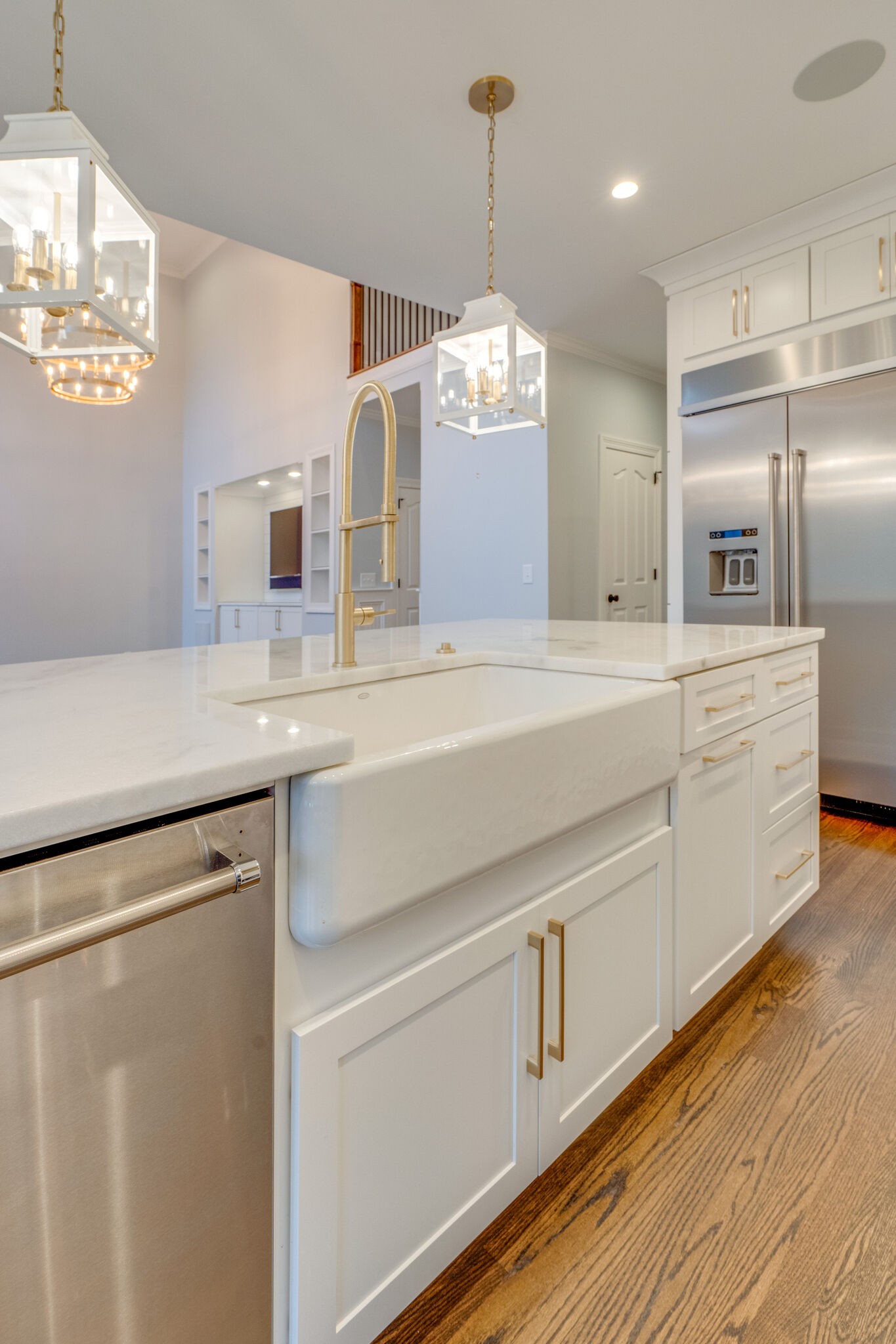 747 High Point Ridge Road Franklin, TN 37069 - Photo 10 of 38 a kitchen with kitchen island white cabinets and stainless steel appliances