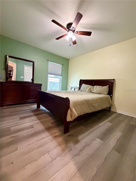 4303 Orange Ridge Court Valrico, FL 33596 - Photo 14 of 40 a bedroom with a bed and window