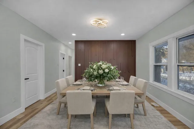 a dining room with furniture and window