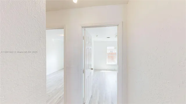 a view of a bathroom with a shower curtain