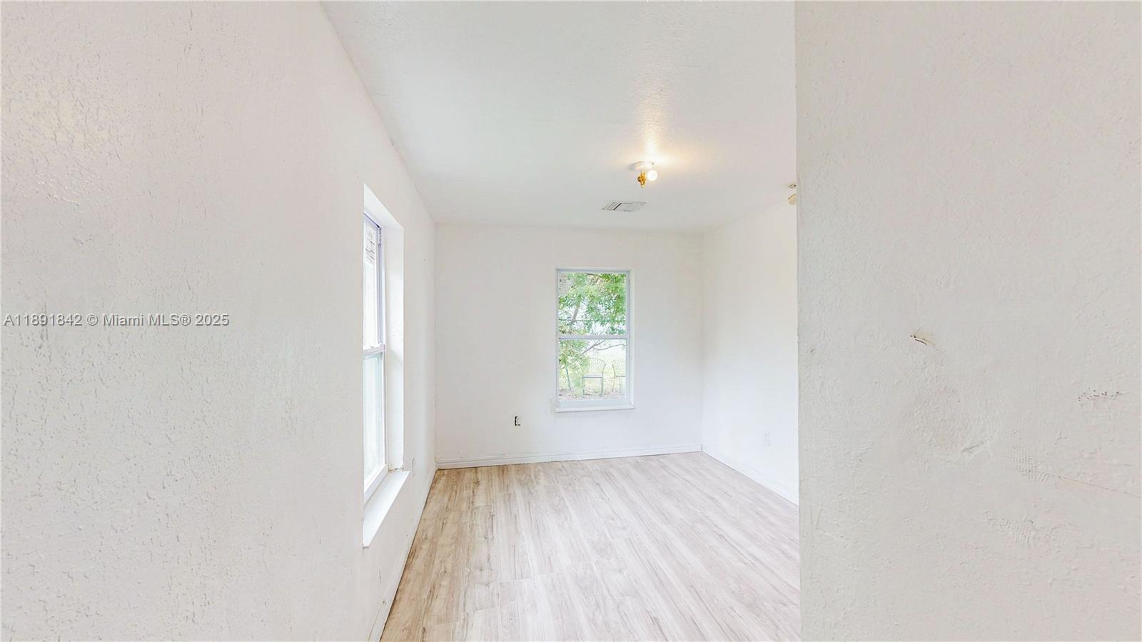 22230 Southwest 115th Court Miami, FL 33170 - Photo 21 of 63 a view of an empty room and window