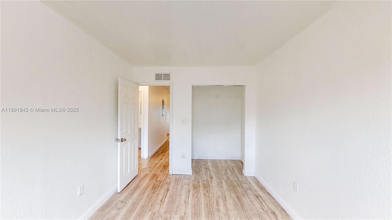 22230 Southwest 115th Court Miami, FL 33170 - Photo 23 of 63 a view of a room with wooden floor and a hallway