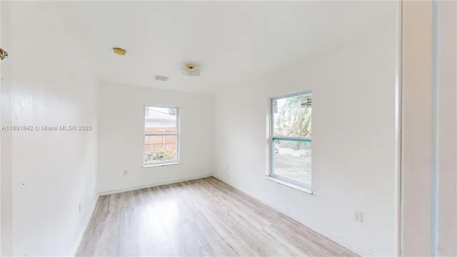 a bathroom with a toilet sink and shower