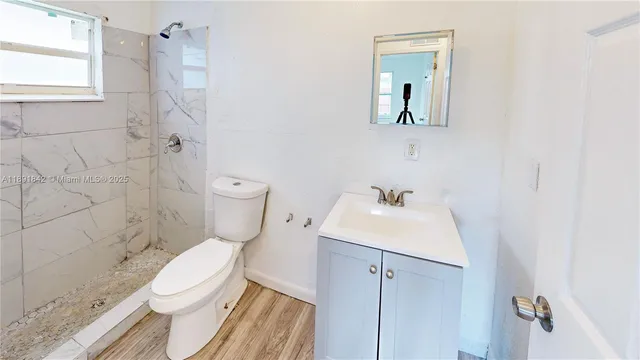 a view of hallway with wooden floor