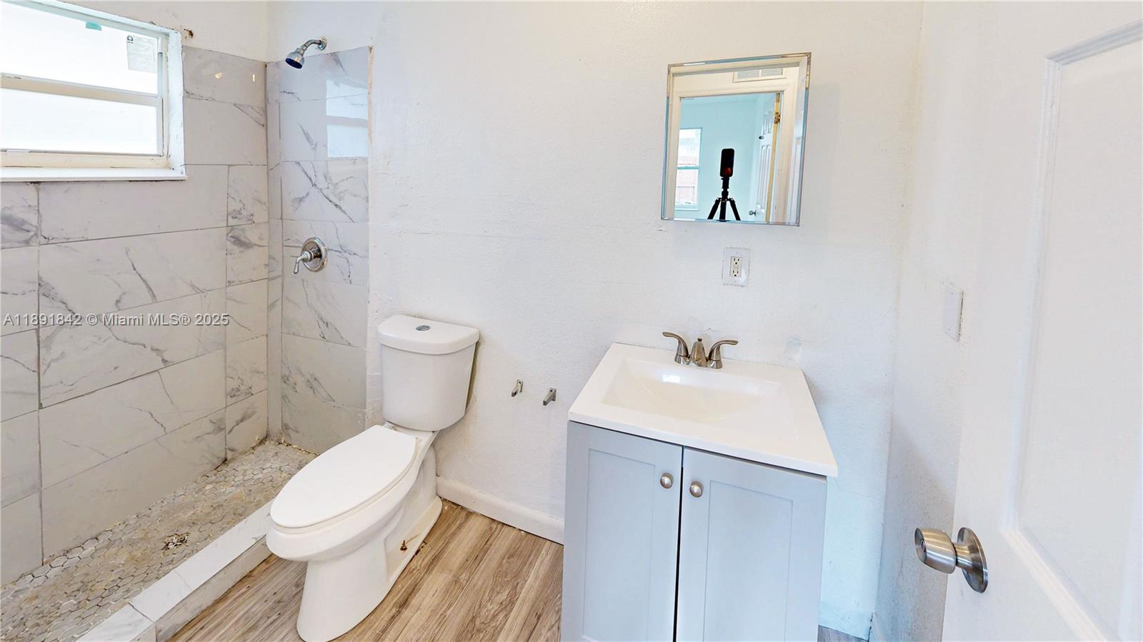 22230 Southwest 115th Court Miami, FL 33170 - Photo 26 of 63 a bathroom with a toilet sink and shower