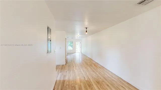 a bathroom with a sink vanity granite and a mirror