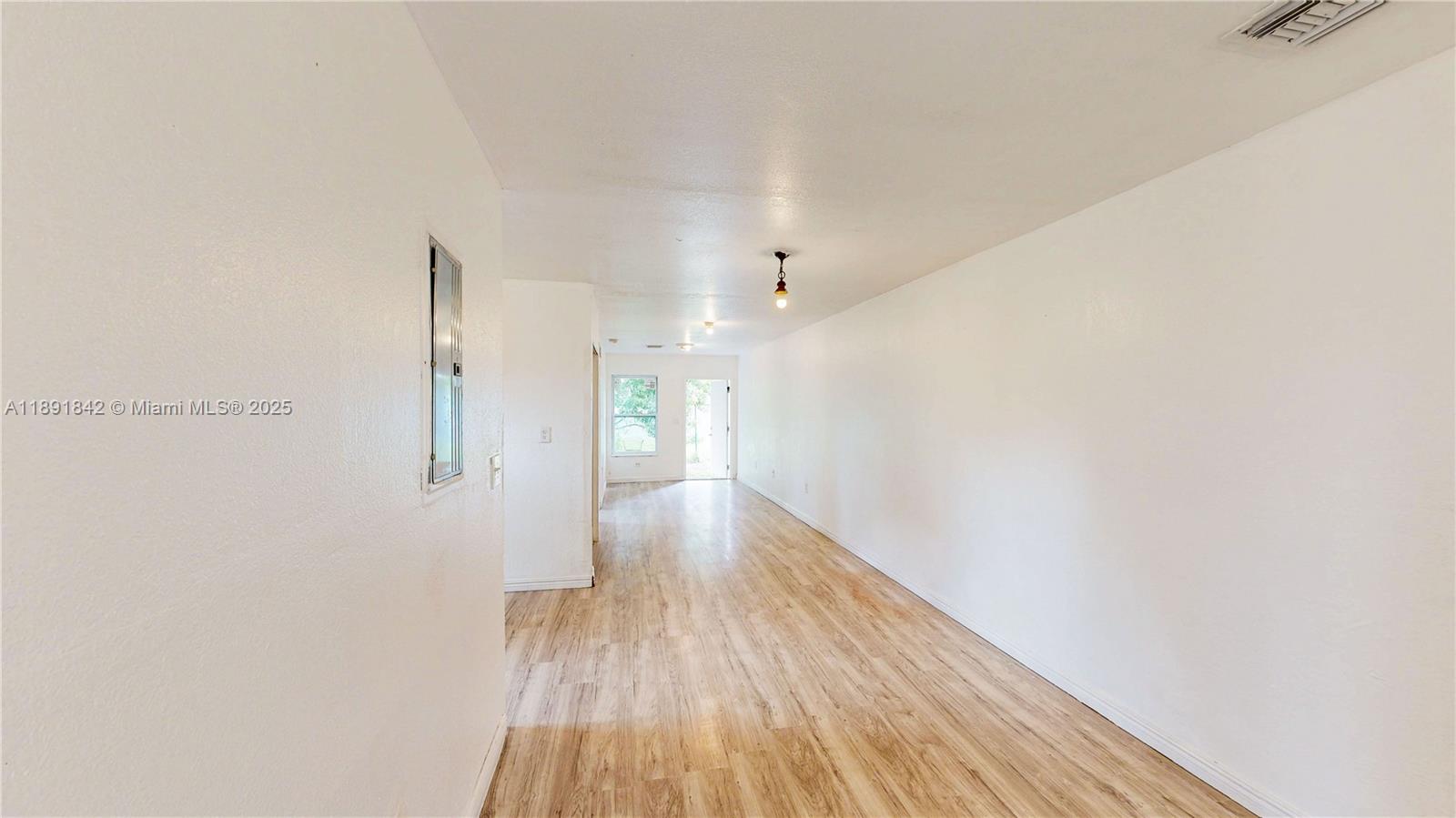 22230 Southwest 115th Court Miami, FL 33170 - Photo 28 of 63 a view of hallway with wooden floor