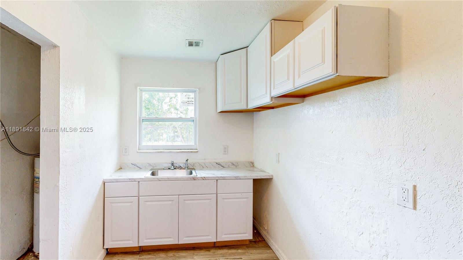 22230 Southwest 115th Court Miami, FL 33170 - Photo 30 of 63 a bathroom with a sink vanity granite and a mirror