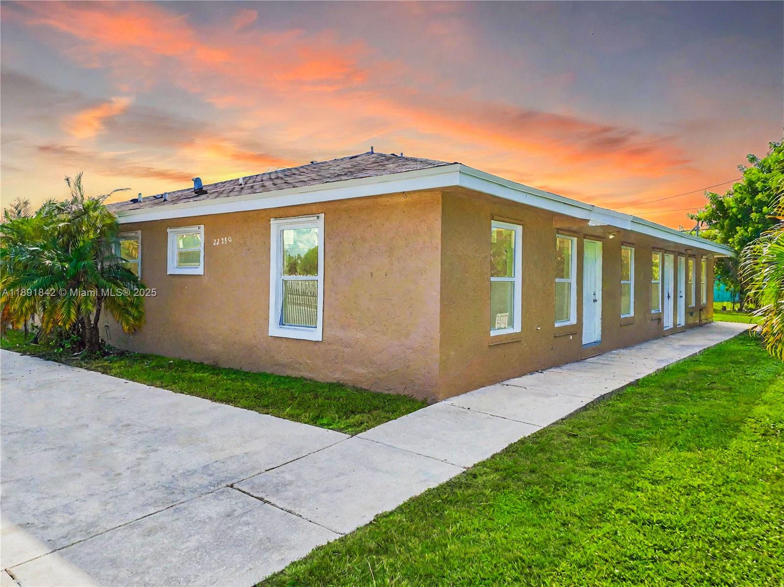 22230 Southwest 115th Court Miami, FL 33170 - Photo 3 of 63 a front view of a house with garden