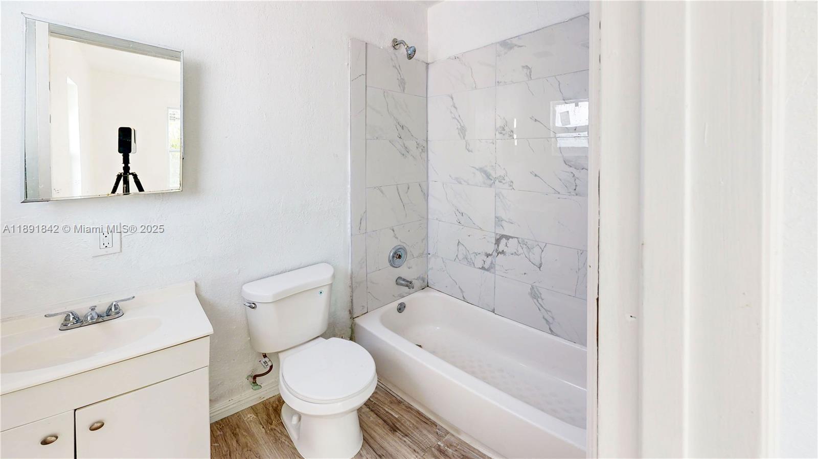 22230 Southwest 115th Court Miami, FL 33170 - Photo 34 of 63 a bathroom with a toilet and a bathtub