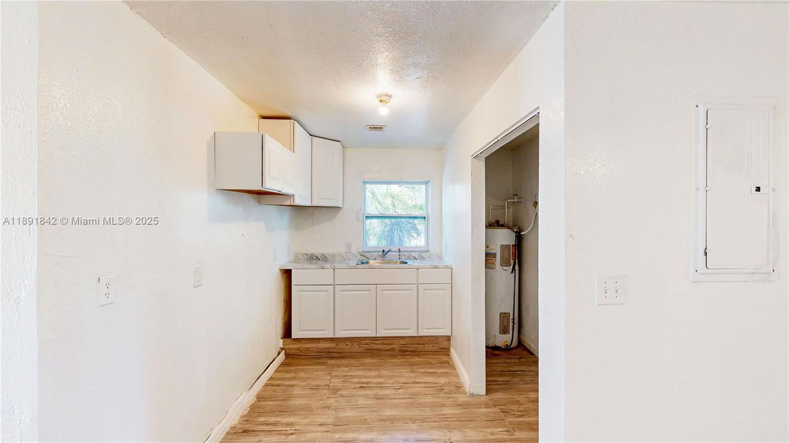 22230 Southwest 115th Court Miami, FL 33170 - Photo 40 of 63 a bathroom with a sink a toilet and mirror