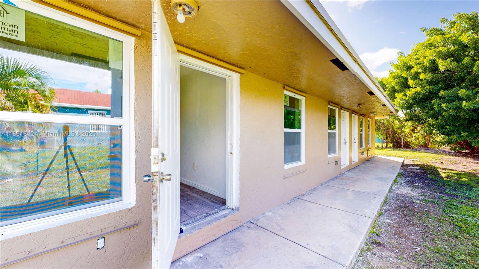 22230 Southwest 115th Court Miami, FL 33170 - Photo 4 of 63 a view of a house with a street