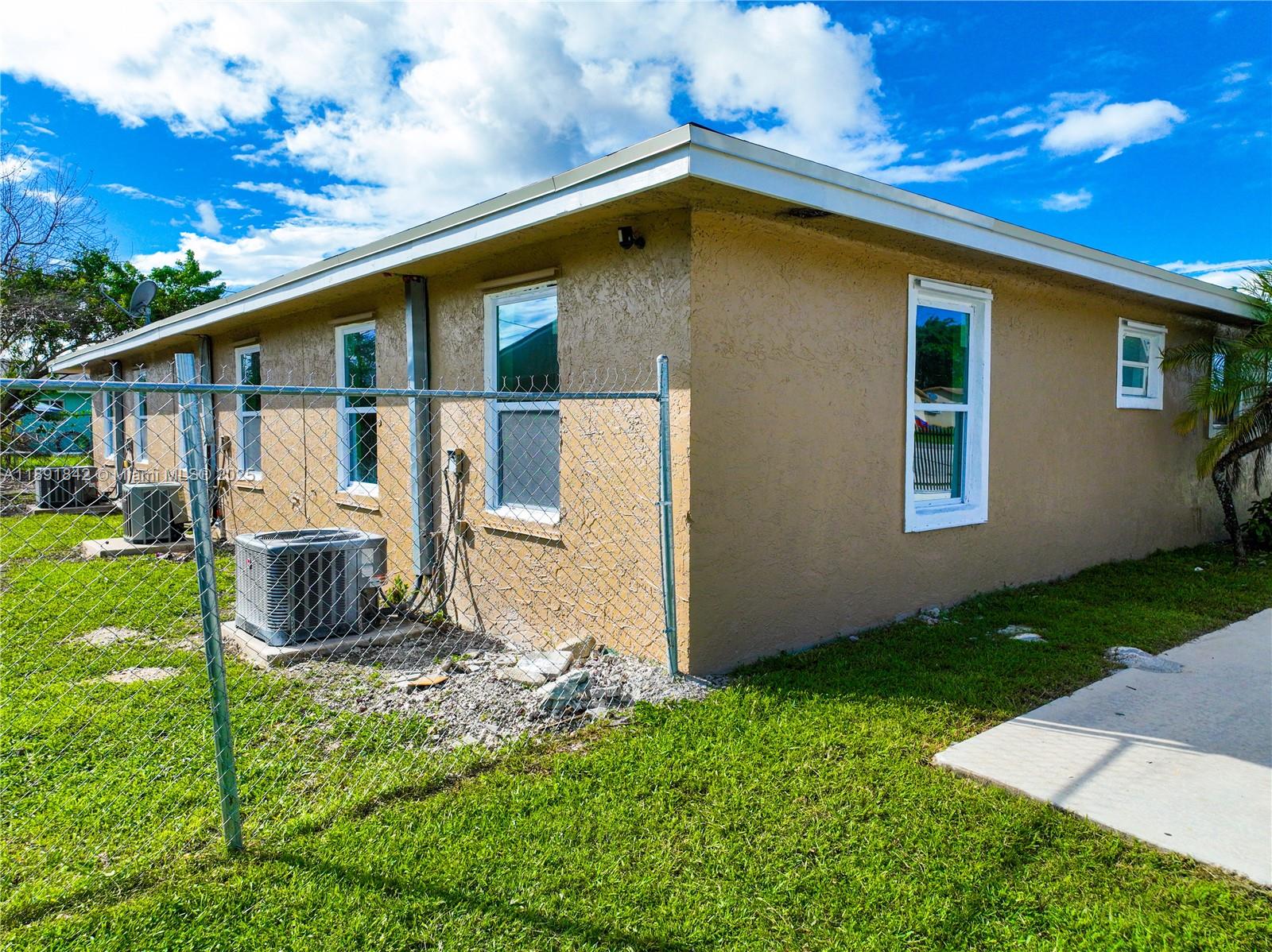 22230 Southwest 115th Court Miami, FL 33170 - Photo 48 of 63 a front view of a house with garden