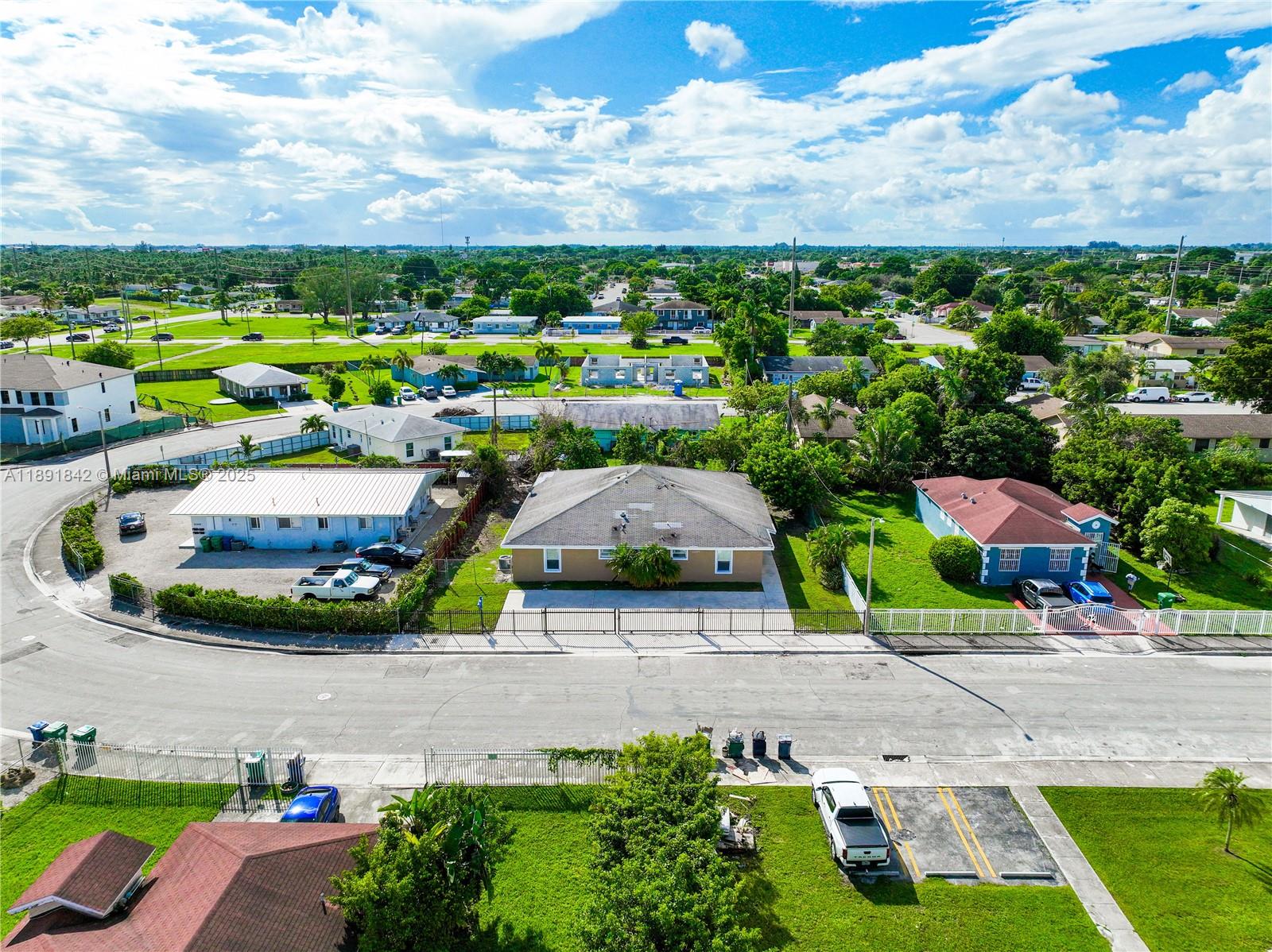 22230 Southwest 115th Court Miami, FL 33170 - Photo 56 of 63 a view of a street with cars parked