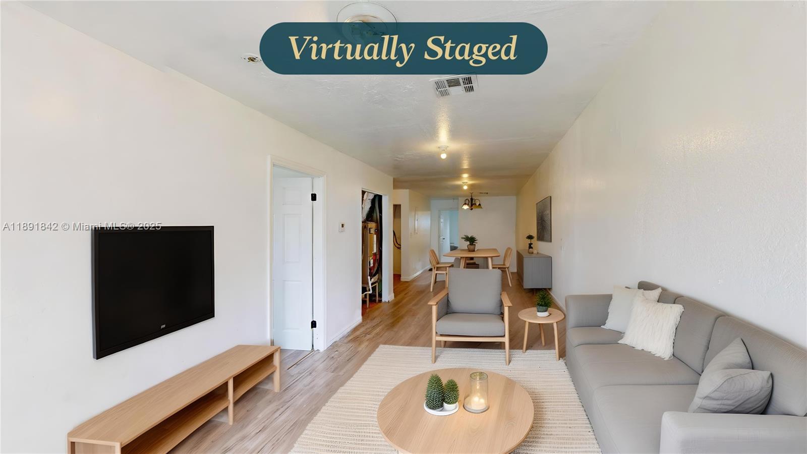 22230 Southwest 115th Court Miami, FL 33170 - Photo 6 of 63 a living room with furniture and a flat screen tv