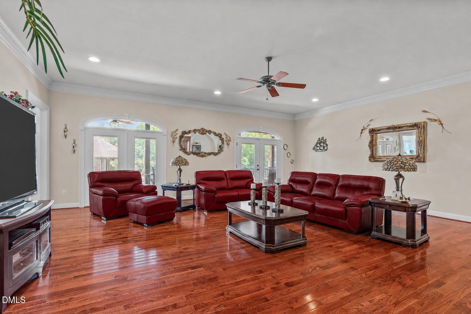 10917 Jordan Road Raleigh, NC 27603 - Photo 14 of 58 a living room with furniture and a flat screen tv
