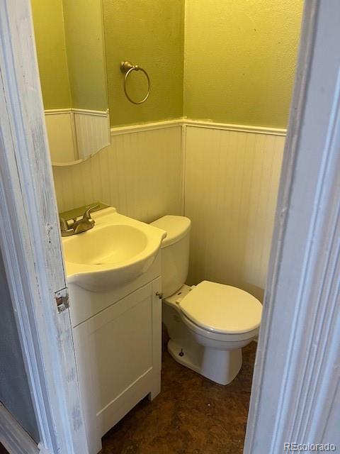 326 Cedar Street Wray, CO 80758 - Photo 17 of 19 a bathroom with a sink and toilet
