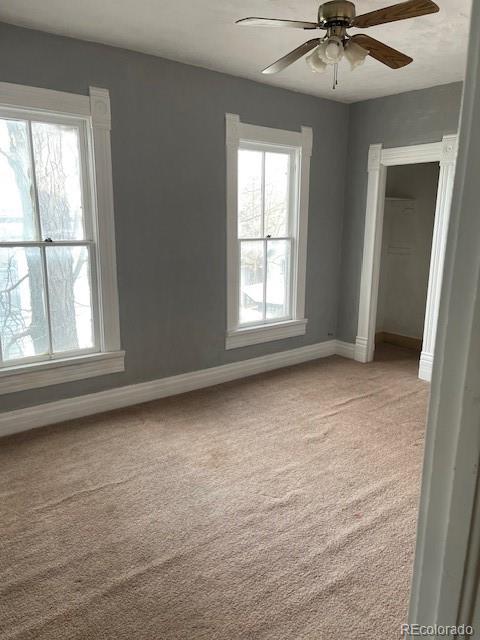 326 Cedar Street Wray, CO 80758 - Photo 18 of 19 an empty room with windows and fan