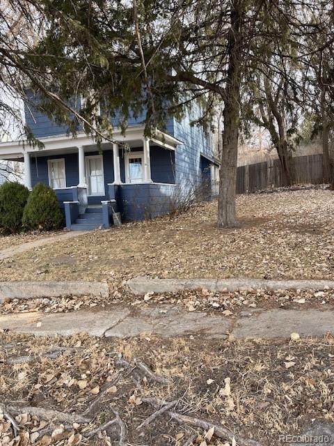 326 Cedar Street Wray, CO 80758 - Photo 2 of 19 a front view of a house with a yard