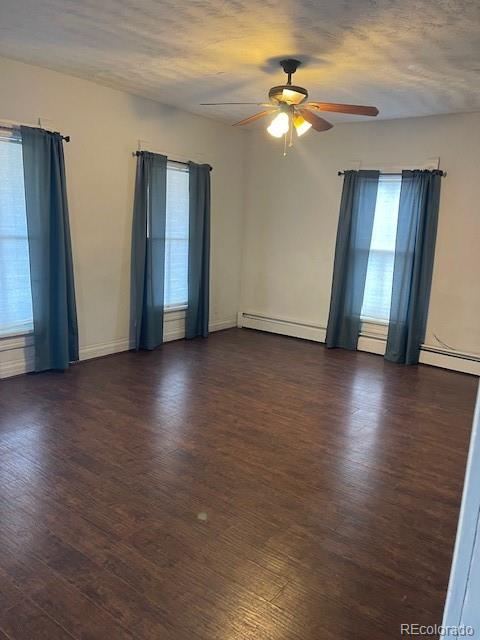 326 Cedar Street Wray, CO 80758 - Photo 3 of 19 a view of an empty room with wooden floor and a window