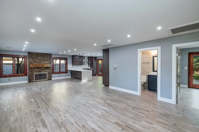 a view of a livingroom with furniture and wooden floor