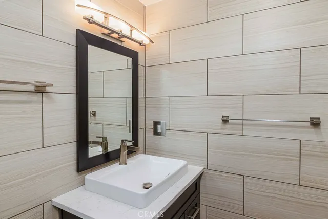 a bathroom with a sink and mirror