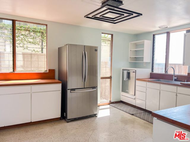 a view of balcony with wooden floor