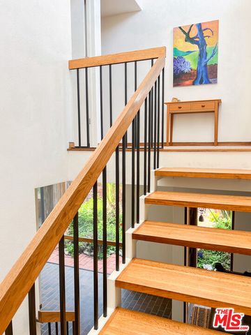 a bedroom with a bed and glass window