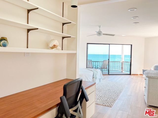 a bathroom with a sink toilet and mirror