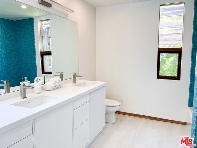 a bath tub sitting next to a shower