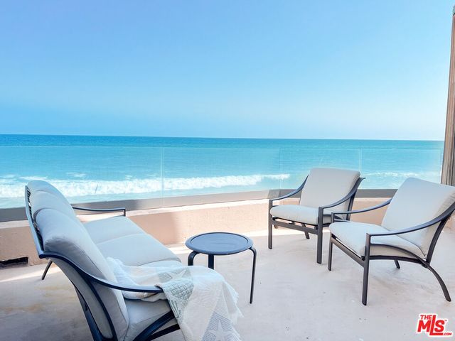 a view of a chairs and table in the terrace