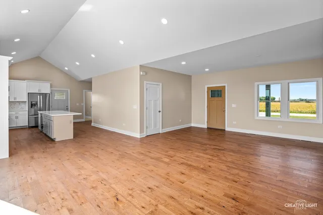 a view of a kitchen with a sink and a window