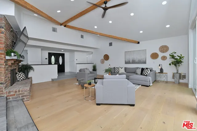 a dining room with furniture and wooden floor