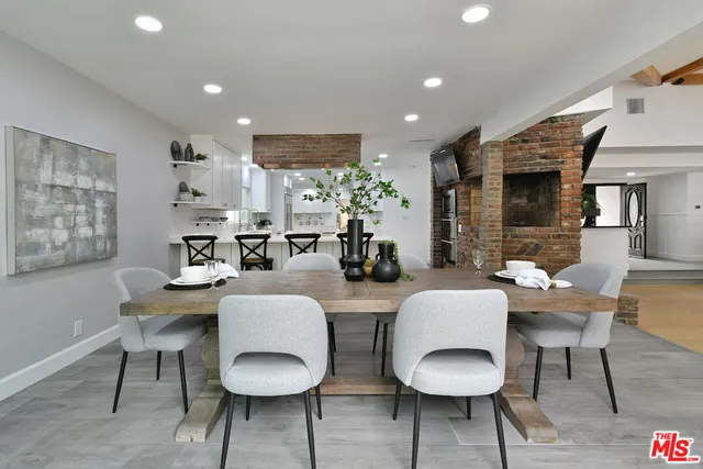 a bedroom with a large bed and a large window