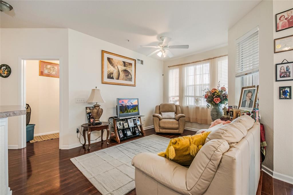 612 Terrace Ridge Circle, Unit 612 Davenport, FL 33896 - Photo 12 of 45 a living room with furniture and wooden floor
