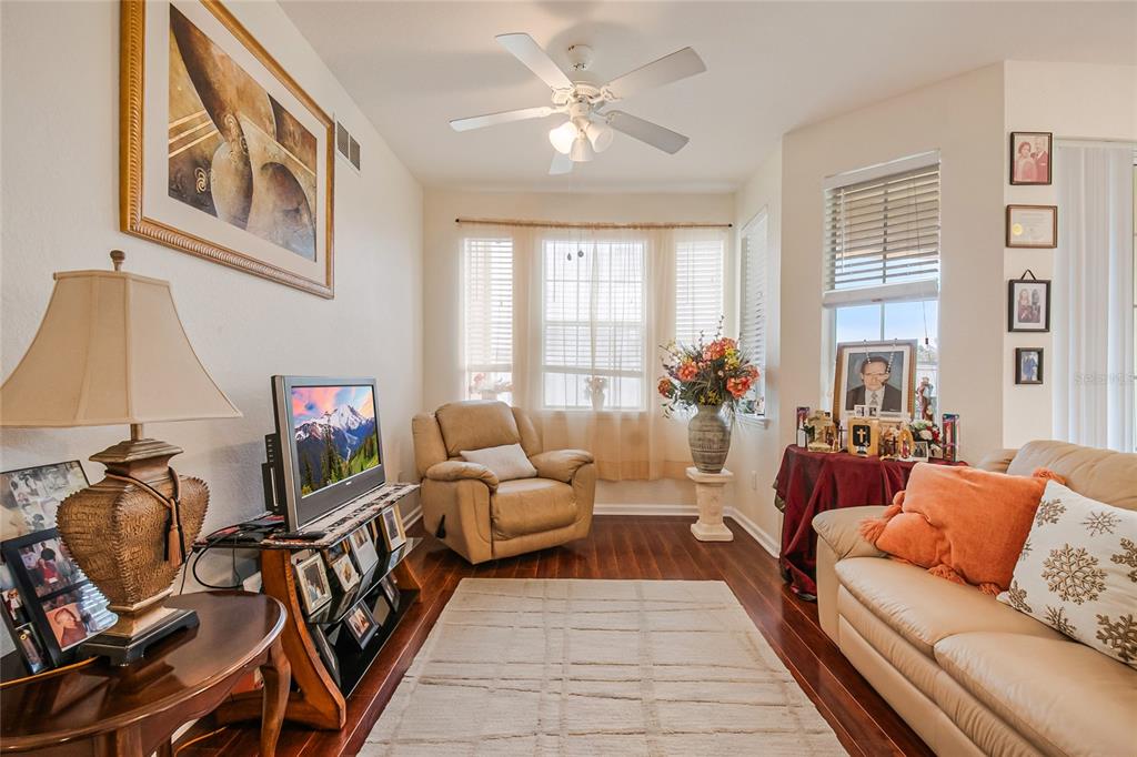 612 Terrace Ridge Circle, Unit 612 Davenport, FL 33896 - Photo 13 of 45 a living room with furniture fireplace and a window