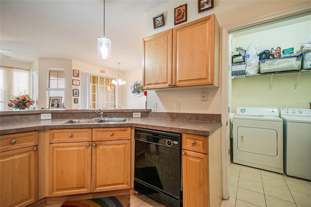 612 Terrace Ridge Circle, Unit 612 Davenport, FL 33896 - Photo 17 of 45 a kitchen that has a sink and a stove in it