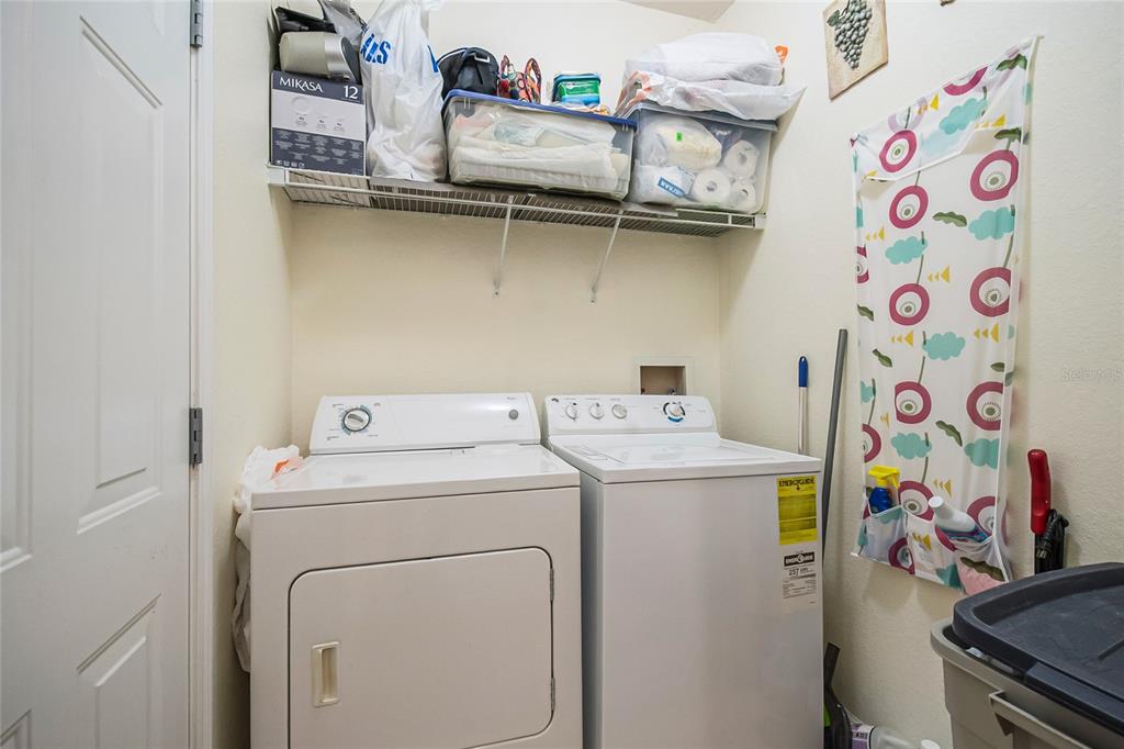 612 Terrace Ridge Circle, Unit 612 Davenport, FL 33896 - Photo 18 of 45 a utility room with dryer and washer